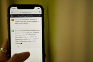 a person on a smartphone interacts with ChatGPT