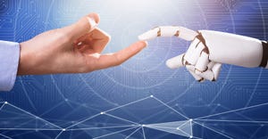 human finger touches robot finger