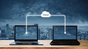 Computer laptops sharing data through cloud storage