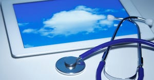 Stethoscope and an Apple iPad 2 that displays a cloud
