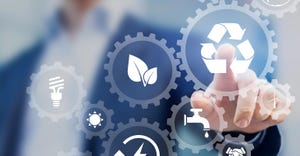 person pressing sustainability button