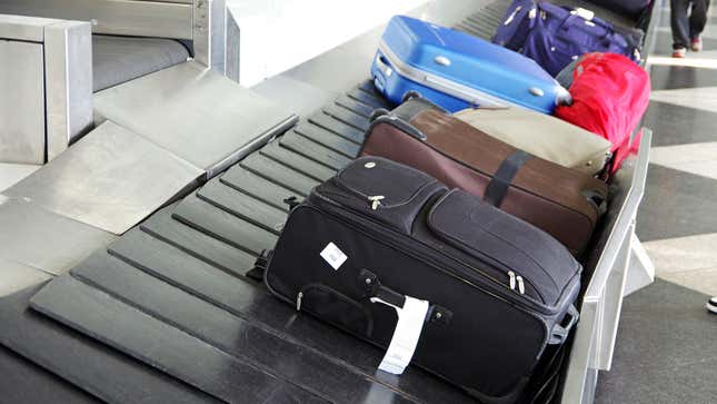 luggage on baggage claim carousel 
