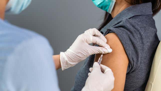 Woman receiving a COVID vaccine