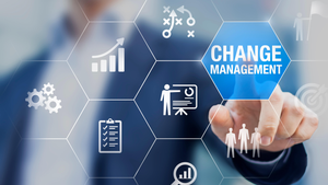 businessman pushing a change management button